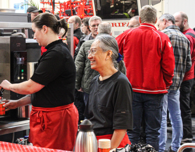 Smiling catering staff member.