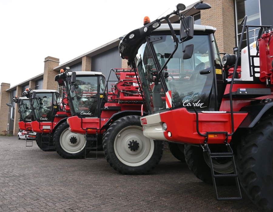 Four Agrifac Condor sprayers standing next to each other in a row.