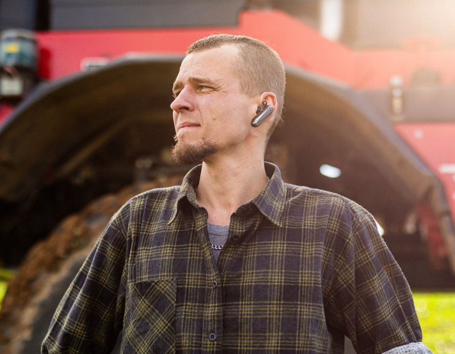 A man standing in front of an Agrifac Condor.