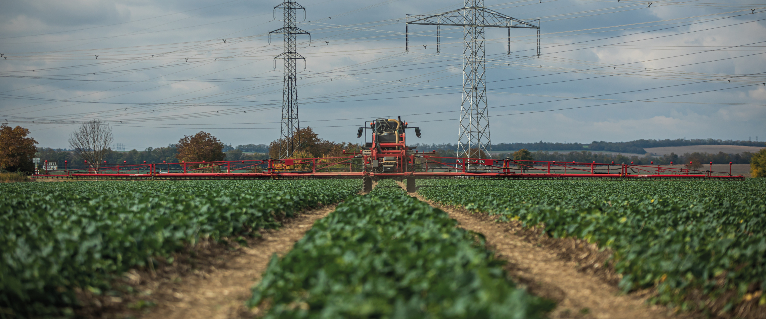 Agrifac sprayer spraying in a green field.