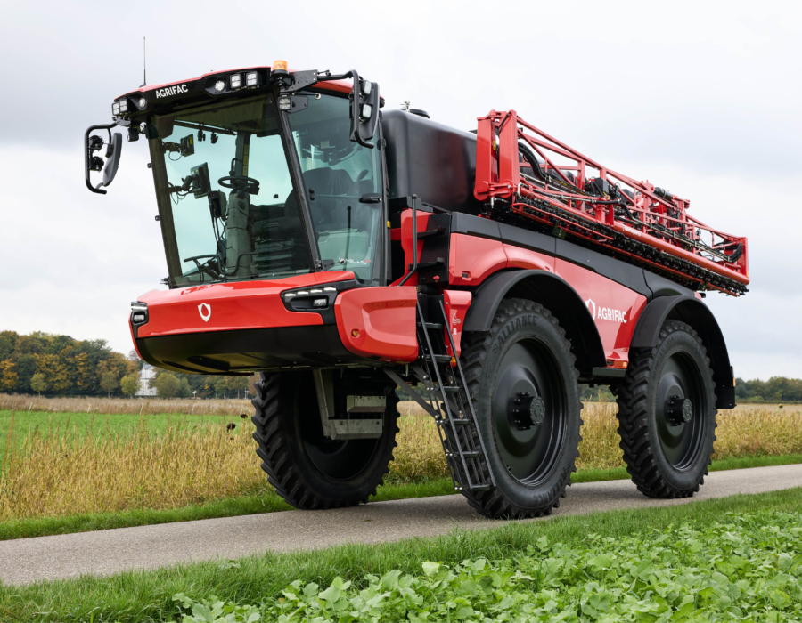 Stationary Vanguard 67 on the road with the boom folded.