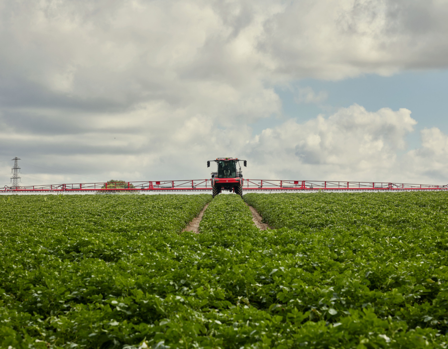 Agrifac sprayer positioned in a field, front view.