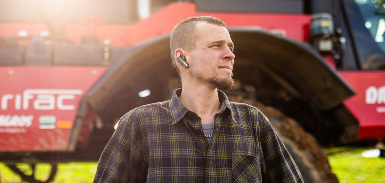 A man standing in front of an Agrifac Condor.