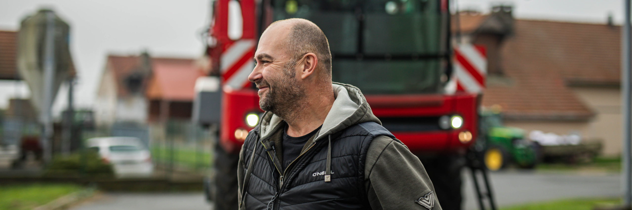 Man standing in front of an Agrifac sprayer.