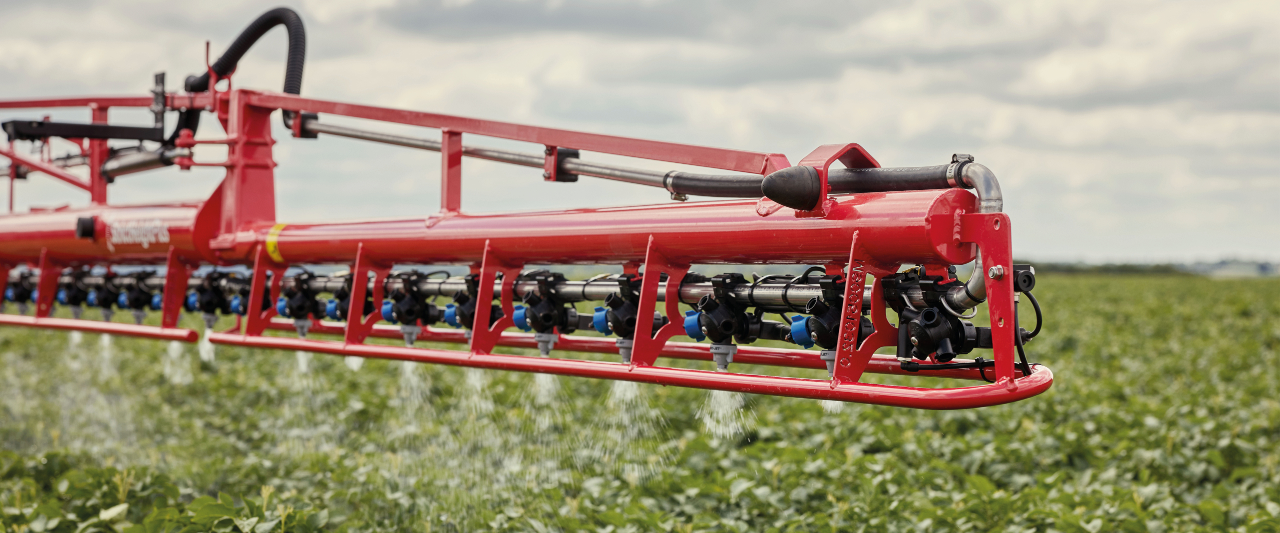 Side view of the StrictSprayPlus operating in the field.