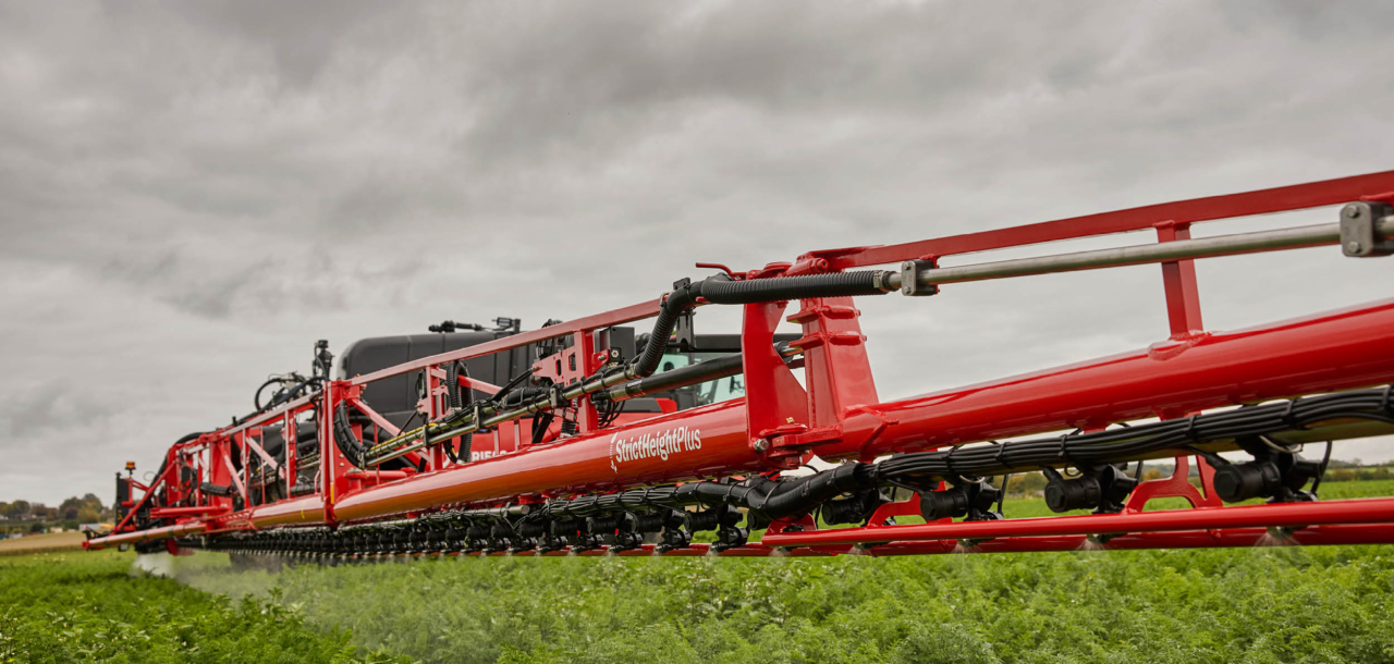 Agrifac Vanguard 55 sprayer spraying in a green field.