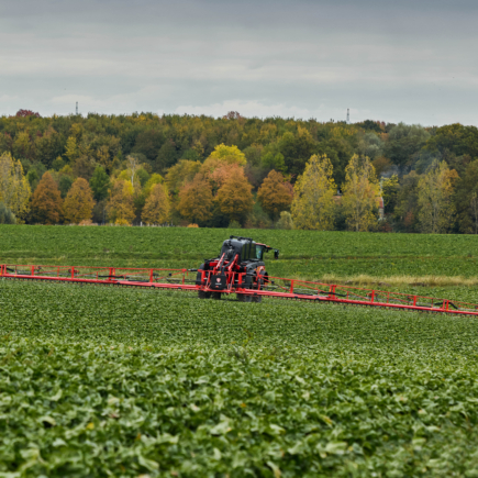 Rear view of the Vanguard 55 spraying in a hilly landscape.
