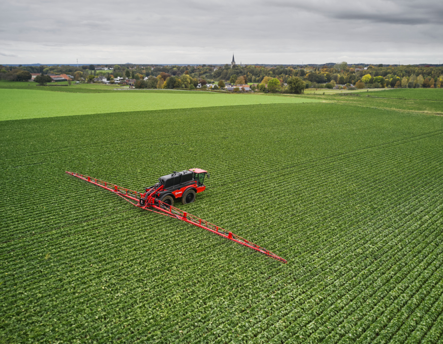 Vanguard 67 operating in a vast green field.