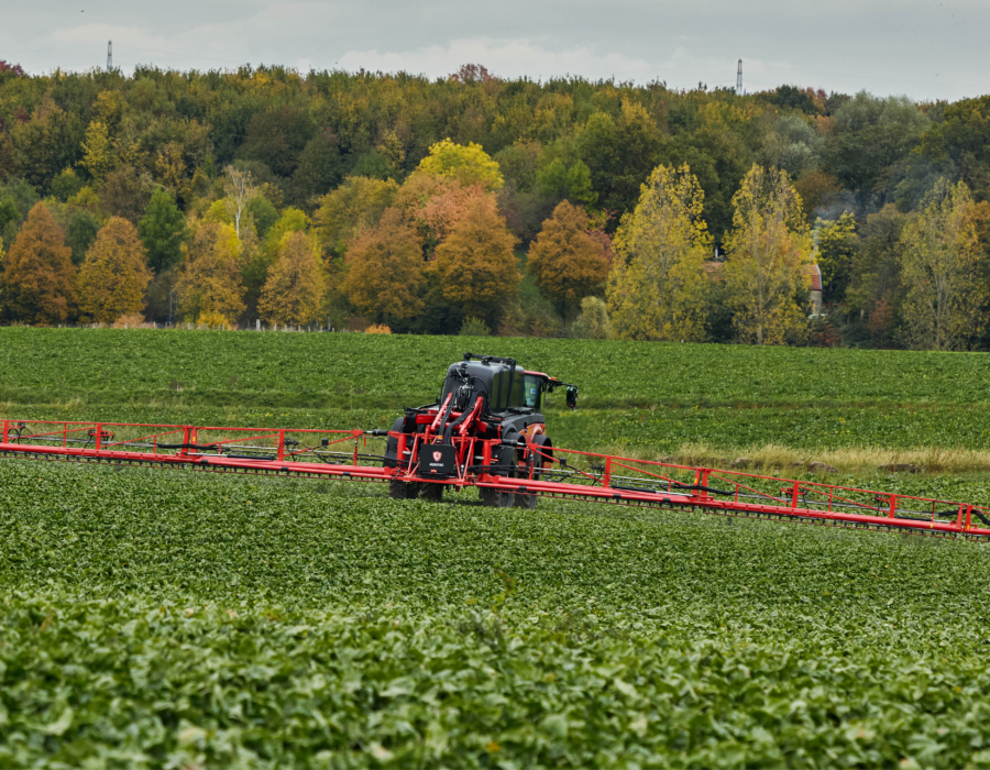 Rear view of the Vanguard 55 spraying in a hilly landscape.