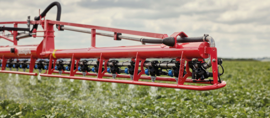 Side view of the StrictSprayPlus operating in the field.