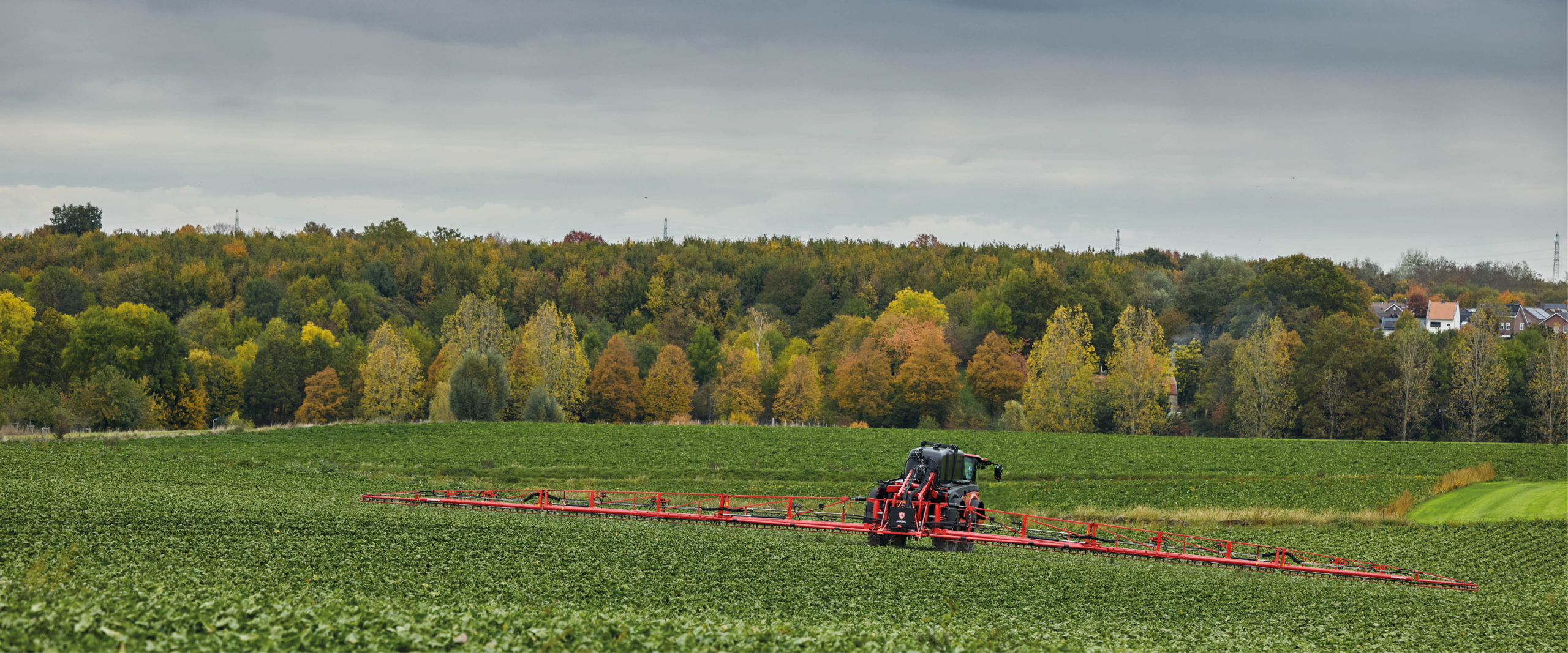 Agrifac Vanguard 55 sprayer spraying in a green field.