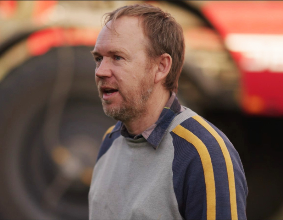 Agrifac customer Tim Rethus standing in front of his sprayer.