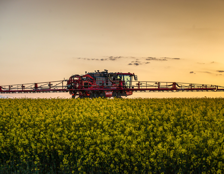 Condor Clearance operating in a field with lights on.