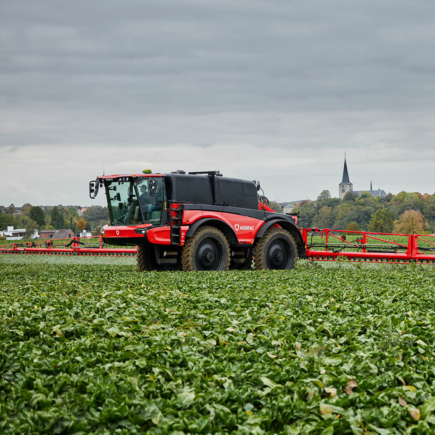 Agrifac Vanguard 67 sprayer driving through a green landscape.