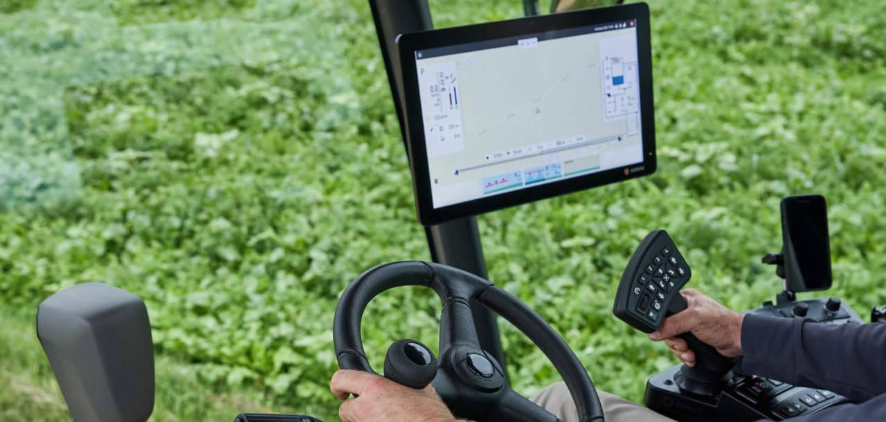 Inside view of the Agrifac cab showing the EcoTronicPlus operating screen.