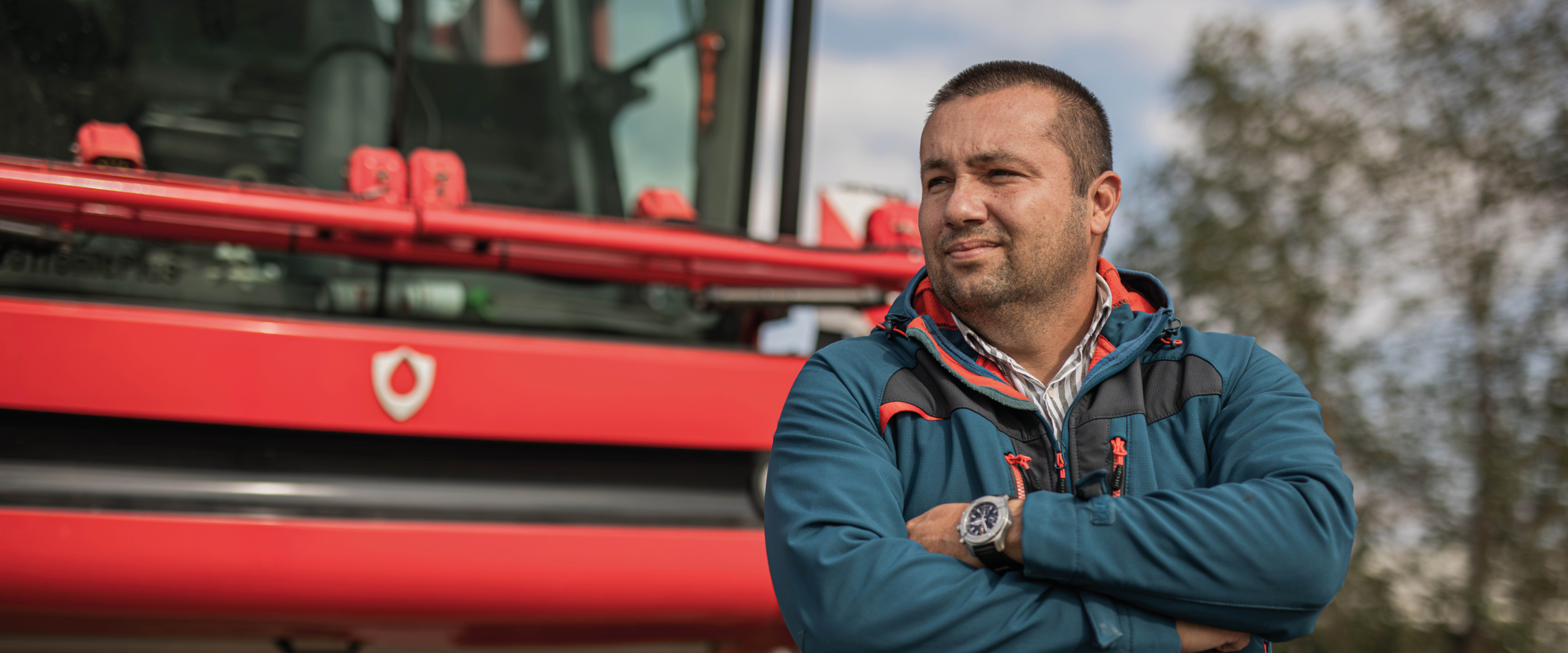 Alexander Degianski from Forest and Biomass Romania standing next to the AICPlus sprayer.
