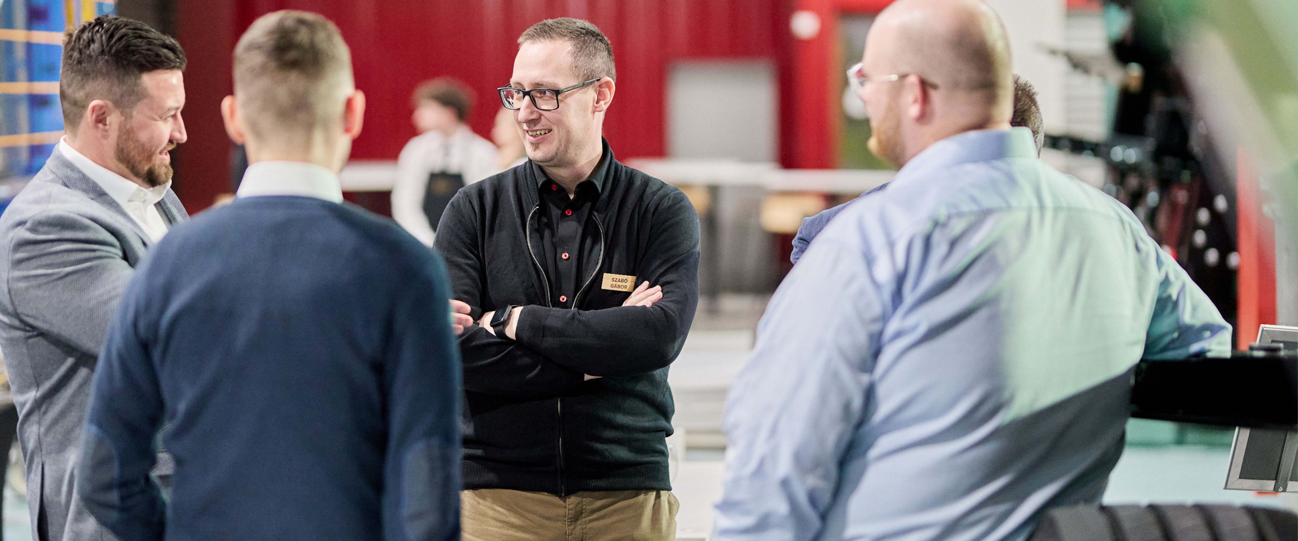 Group of people listening to each other in conversation.